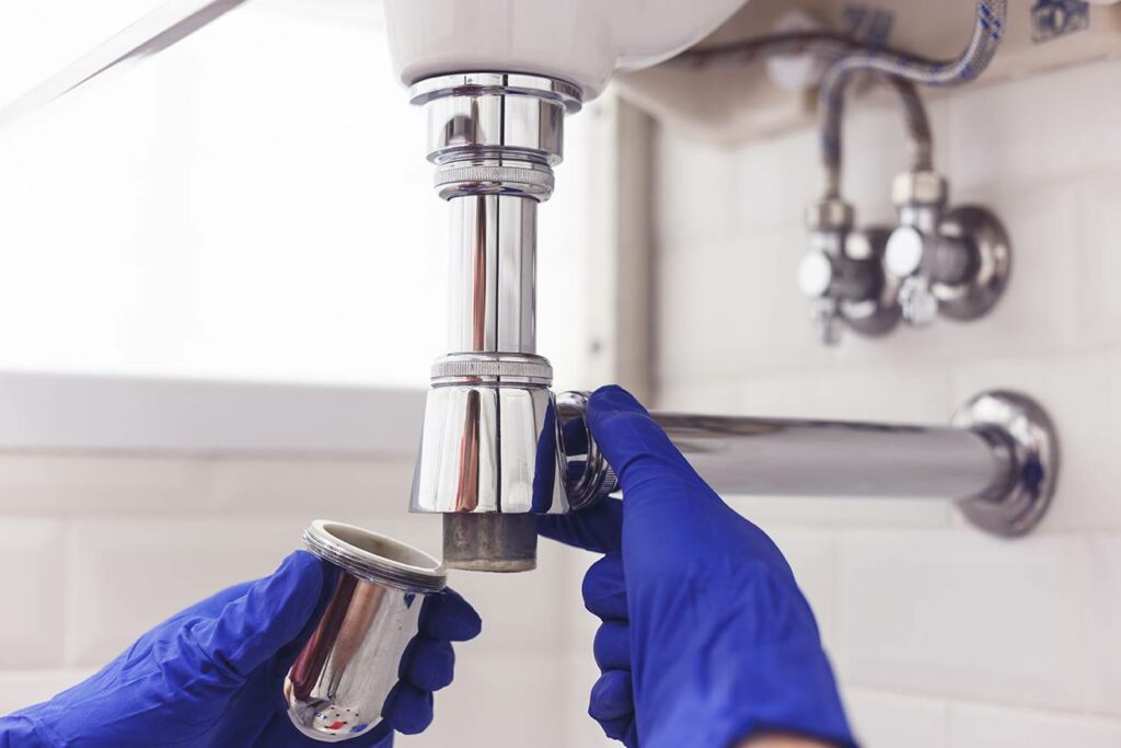 Siphon démonté par un plombier