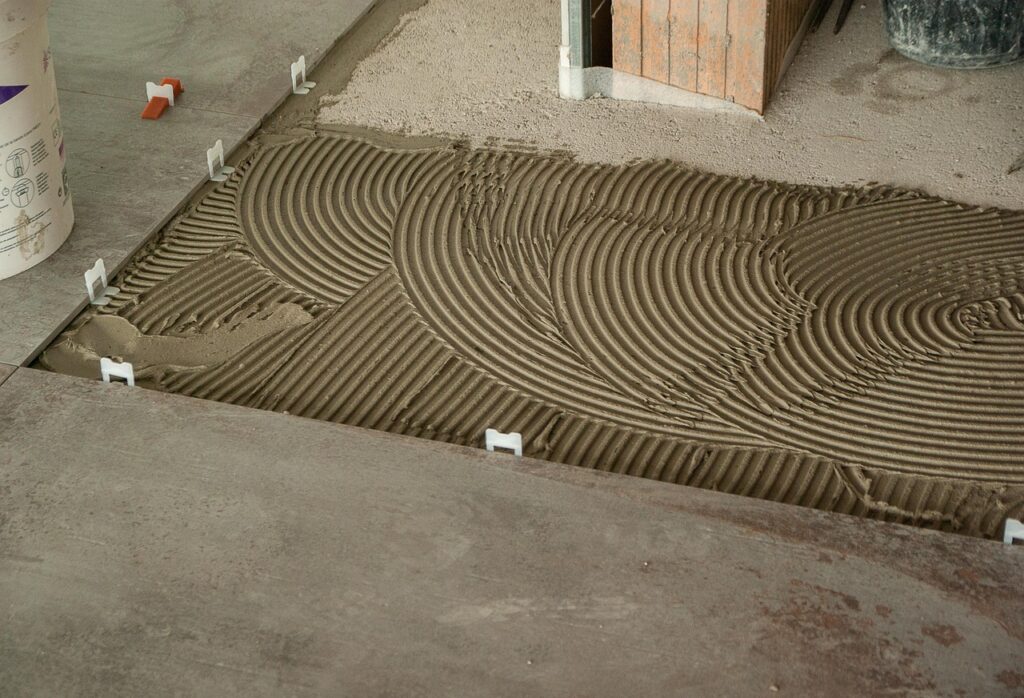 Sol encolé avant pose de carrelage